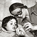 nurse taking boys temperature